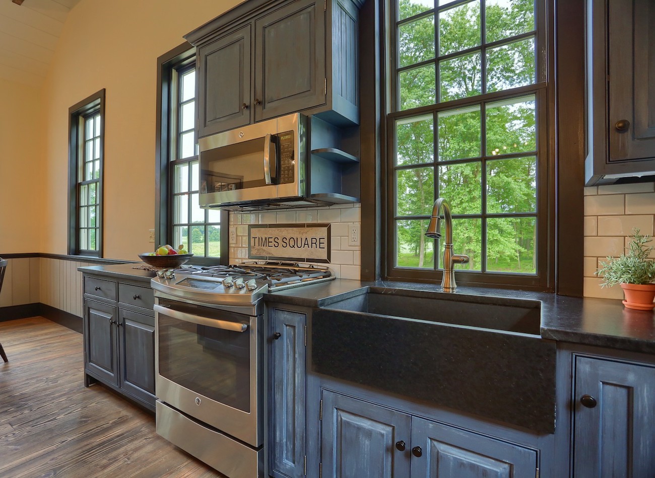 Large kitchen with blue cabinets in an olde bulltown home