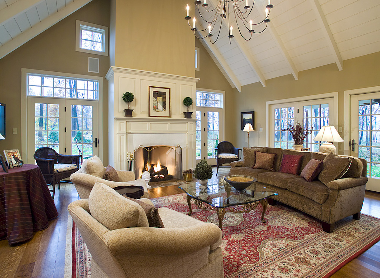 Living room with fireplace and chandelier in an olde bulltown home