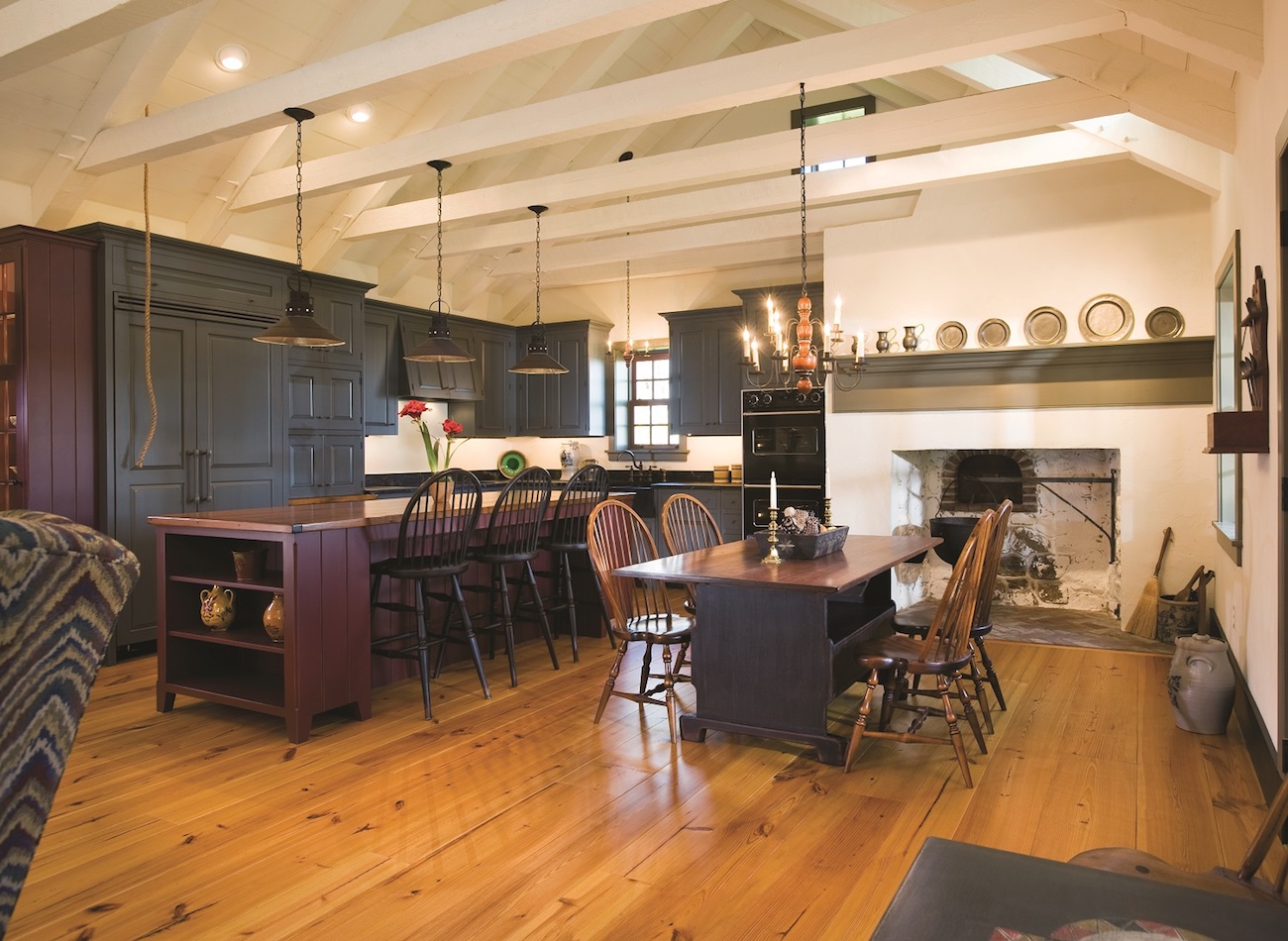 Kitchen and dining room with fireplace in an olde bulltown home