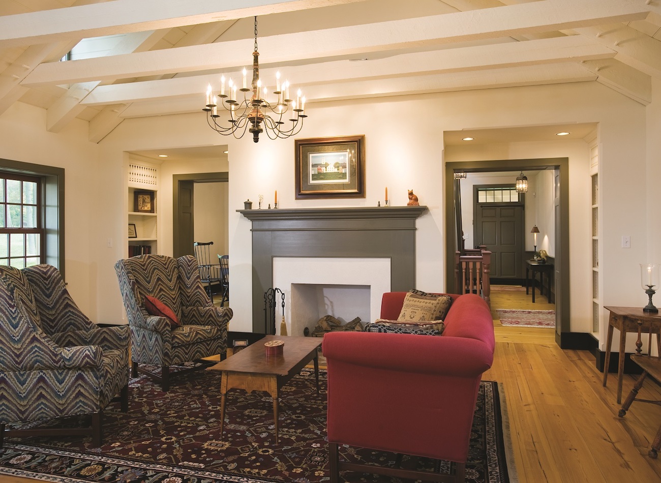 Living room with fireplace in an olde bulltown village home