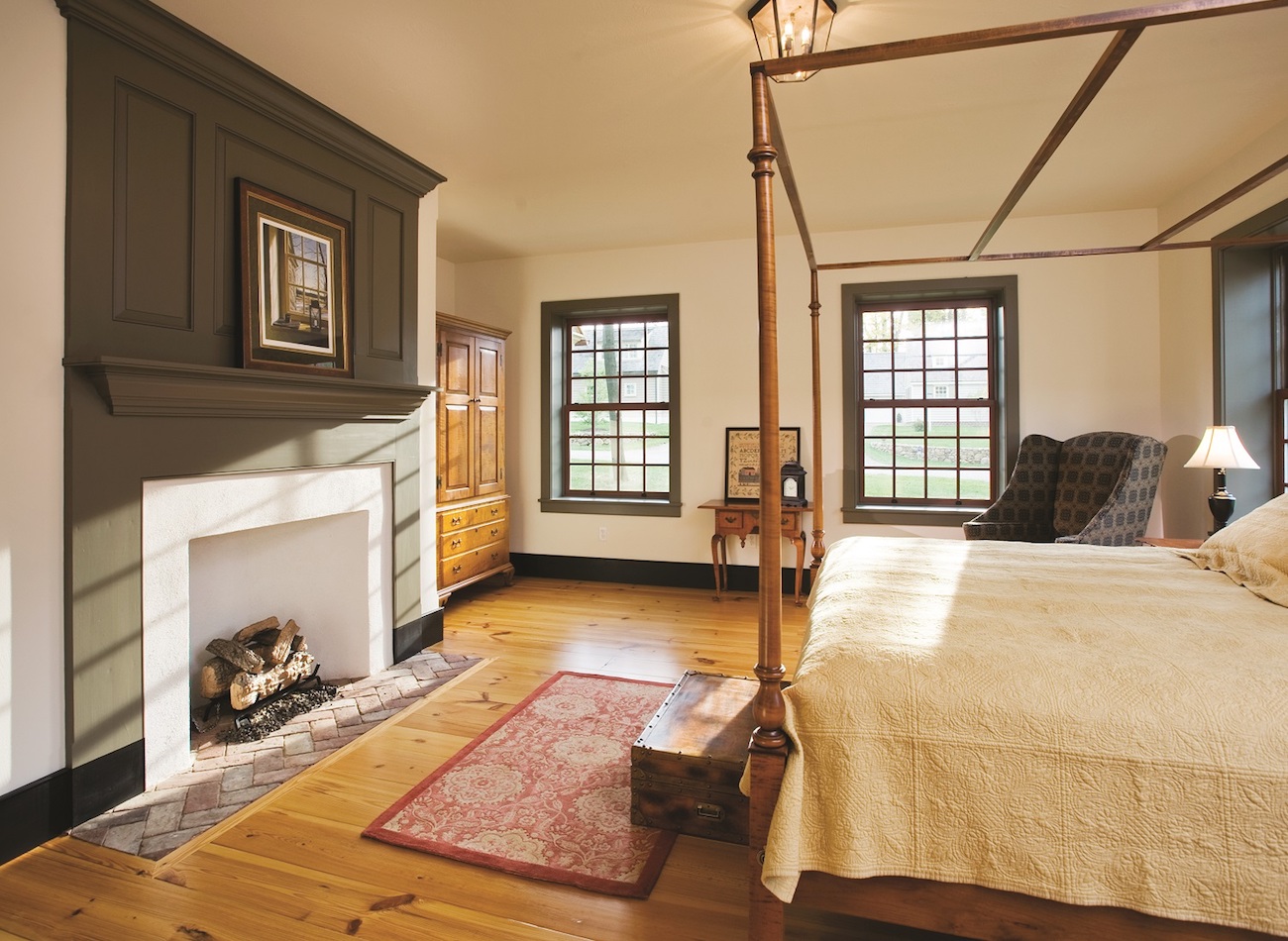 Large bedroom with fireplace in an olde bulltown home