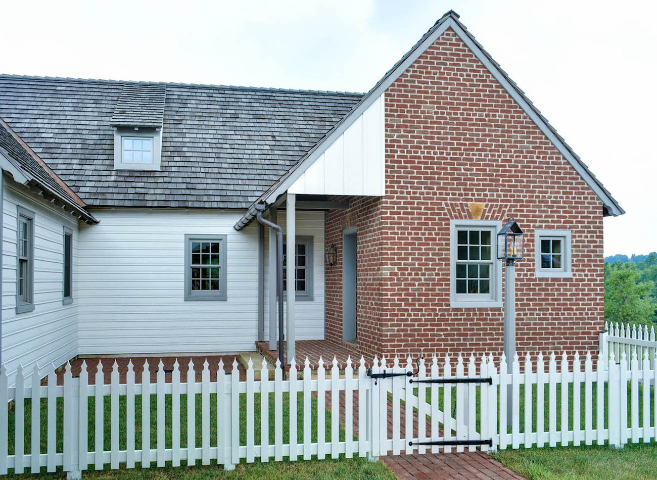 Front of an olde bulltown home with white siding