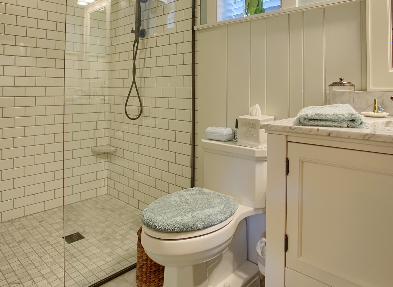 Full bathroom with glass door shower in an olde bulltown home