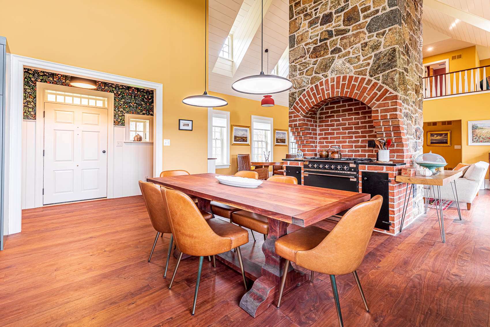 Dining room with stove built into fireplace in an olde bulltown home