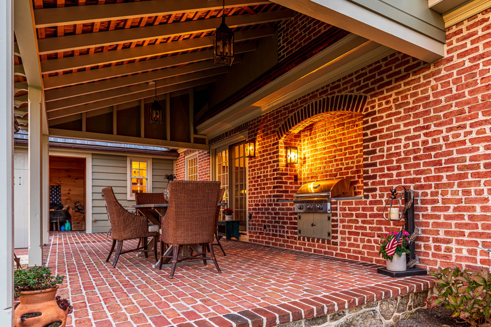 Brick patio with furniture and a fireplace in olde bulltown